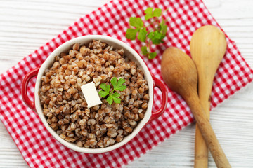 Buckwheat porridge with butter in bawl - breakfast, healthy food