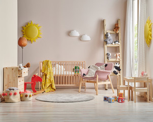 Modern baby room concept cradle bed and wooden cabinet, toys and table style.