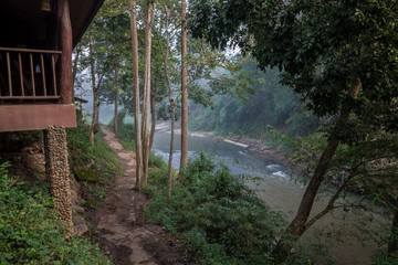 Thai forest river scene with hut