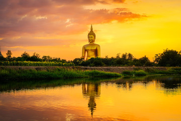 Fototapeta na wymiar Large golden Buddha statue at Wat Muang, Ang Thong Province, Thailand