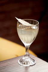 Classic cocktail glass on wood table in night club restaurant