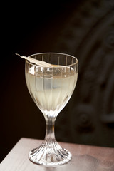 Classic cocktail glass on wood table in night club restaurant