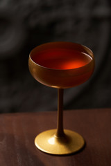 Classic cocktail glass on wood table in night club restaurant
