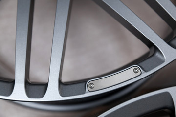 Beautiful alloy car wheels in forged aluminum with knitting needles and titanium silver. Auto...