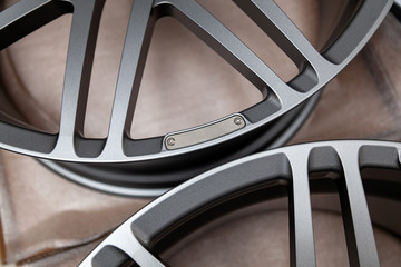 Beautiful alloy car wheels in forged aluminum with knitting needles and titanium silver. Auto...