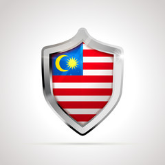 Fototapeta premium Malaysia flag projected as a glossy shield on a white background