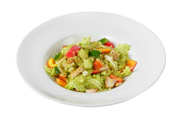 Caesar salad with pieces of chicken breast, tomato, bell pepper, cucumber, lettuce, walnuts on plate, white isolated background Side view. For the menu, restaurant, bar, cafe