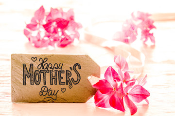 One Label WIth English Calligraphy Happy Mothers Day. Pink Spring Flower Blossom On Wooden Background