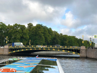 Fototapeta na wymiar Panteleymonovsky Bridge or Pestel Bridge seen from Fontanka River, St.Petersburg, Russia