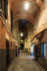 Fototapeta premium Night view of Laigueglia narrow street, Italian Riviera