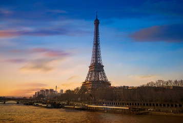 Fototapeta na wymiar Eiffel tower and Seine river in the sunset sky scene.