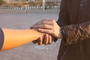 Close up of man hand holding woman couple which  man reaching to help concept