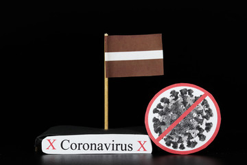 Flag of Latvia with cell of Covid-19 type which is of a group of RNA viruses. Pandemic disease on...