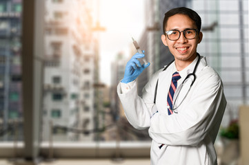 the double exposure image of the doctor standing and overlay with cityscape image. the concept of medical, healthy, clinical and coronavirus.