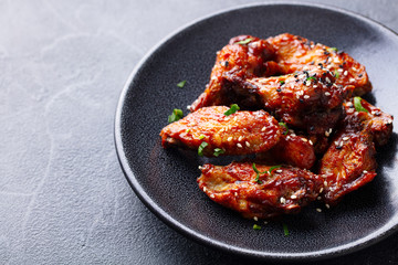 Chicken wings. Traditional asian recipe. Grey background. Close up.