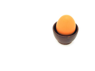  Fresh egg in wooden brown bowl isolated on a white background. High protein. 