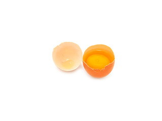  Fresh half-cracked egg isolated on a white background.  High protein and vitamins, Concept of healthy.