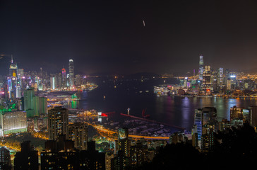 Fototapeta na wymiar Cityscape Hong Kong city buildings surround wide harbour