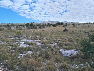 Fototapeta na wymiar Panoramic view of rural area near mountain and cirrus clouds