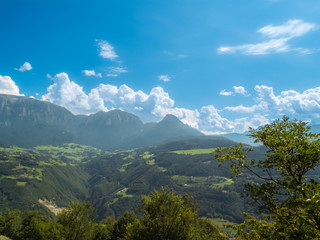 Naklejka premium The view of the dolomite mountain is south Tirol in Italy. Sunny summer day with blue sky and clouds.
