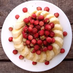  raw strawberry and banana desert on white dish