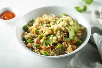 Healthy quinoa bowl with soy beans and avocado