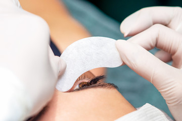 Close up put strip under eye.