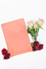 Moisturizing lifting facial sheet mask with flower roses extracts. Skin care and treatment, spa, natural beauty and cosmetology concept, mock up, white background