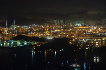 Fototapeta na wymiar Container port modern Hong Kong city with bright illumination