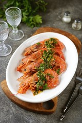 Fried large prawns with garlic, ginger and parsley in olive oil.