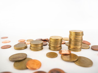 Thai Baht Coins colors Gold set in the mountains,Is the currency of Thailand.For business expenses,Coin is in a jar of money saving,White background