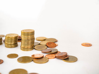 Thai Baht Coins colors Gold set in the mountains,Is the currency of Thailand.For business expenses,Coin is in a jar of money saving,White background