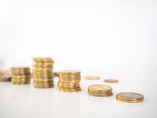 Thai Baht Coins colors Gold set in the mountains,Is the currency of Thailand.For business expenses,Coin is in a jar of money saving,White background