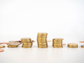 Thai Baht Coins colors Gold set in the mountains,Is the currency of Thailand.For business expenses,Coin is in a jar of money saving,White background