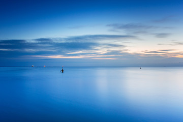 Beautiful sunrise over calm Baltic Sea in Poland