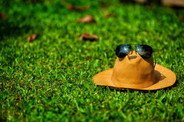 Hat with glasses placed on top, holiday relaxation concept
