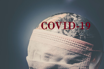Fototapeta na wymiar coronavirus world alert - surgical mask on globe