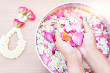 Thai people celebrate Songkran the new year water festival by giving garlands to their seniors and asked for blessings