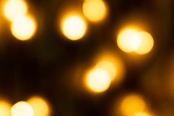 Bokeh lights,Bokeh lights background,Gold glitter with bokeh effect on dark background.