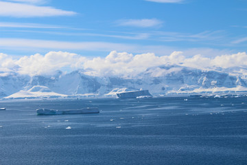 Frozen coasts, icebergs and mountains of the Antarctic Peninsula. The mountains at Paradise Bay on the Danco Coast, Antarctica