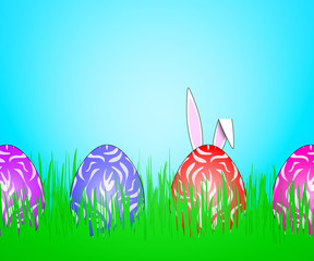 Easter eggs hidden in green grass.
