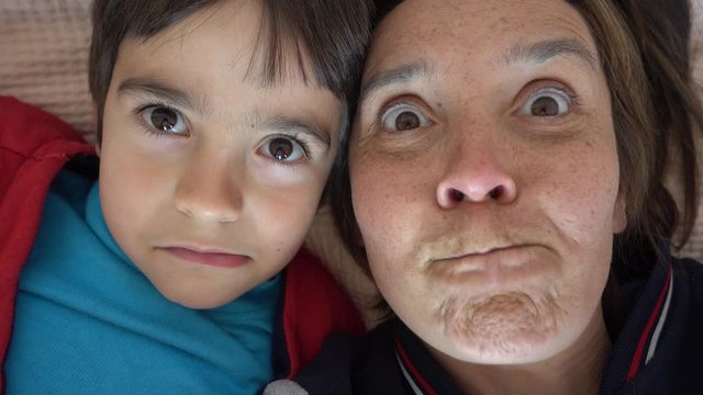 4K Selfie of Mom and son making faces on camera