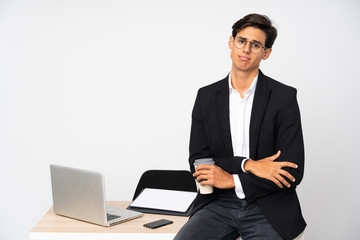 Businessman in his office over isolated white background sad
