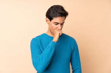 Man over isolated background is suffering with cough and feeling bad