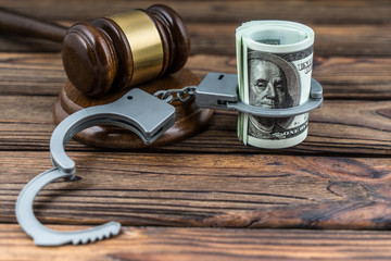 Money dollar banknote in handcuffs, gavel judge. Concept business finance, arrest, account lock, tax. Court law