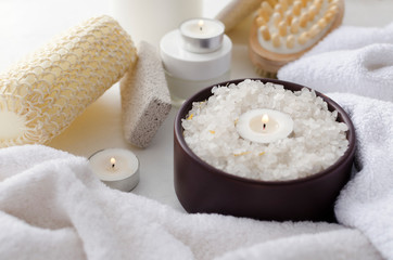 Fototapeta na wymiar Spa procedures. Candles, sea salt, towels, brushes, sponges for massage and shower