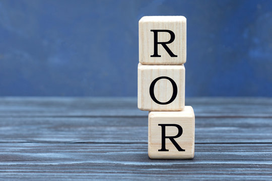 concept word ROR on cubes on a beautiful gray blue background