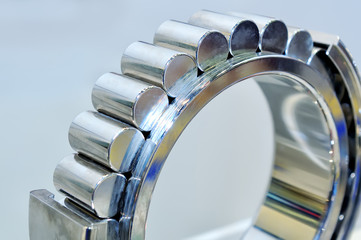 Industrial roller bearing on a light background. Shallow depth of field, selective focus