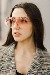 young woman with pink sunglasses,  selective focus, natural light