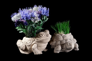 Ornaments for the garden, vases for plants in the shape of a frog and a turtle